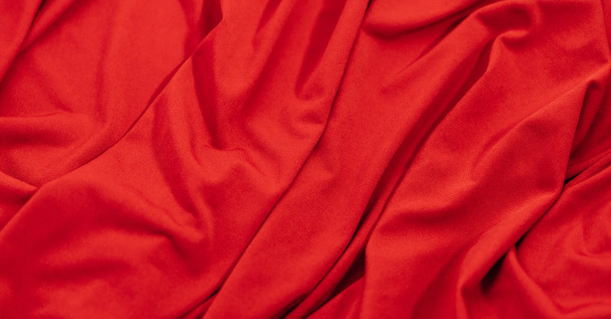 Are there any countries where red clothing is frowned upon? - Close-up Photo of a Red Silk Satin Fabric