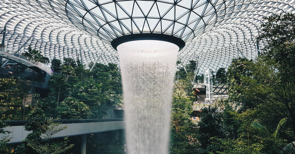 Are there any drinking-water fountains in Prague PRG airport? - Water Falling From Glass Ceiling