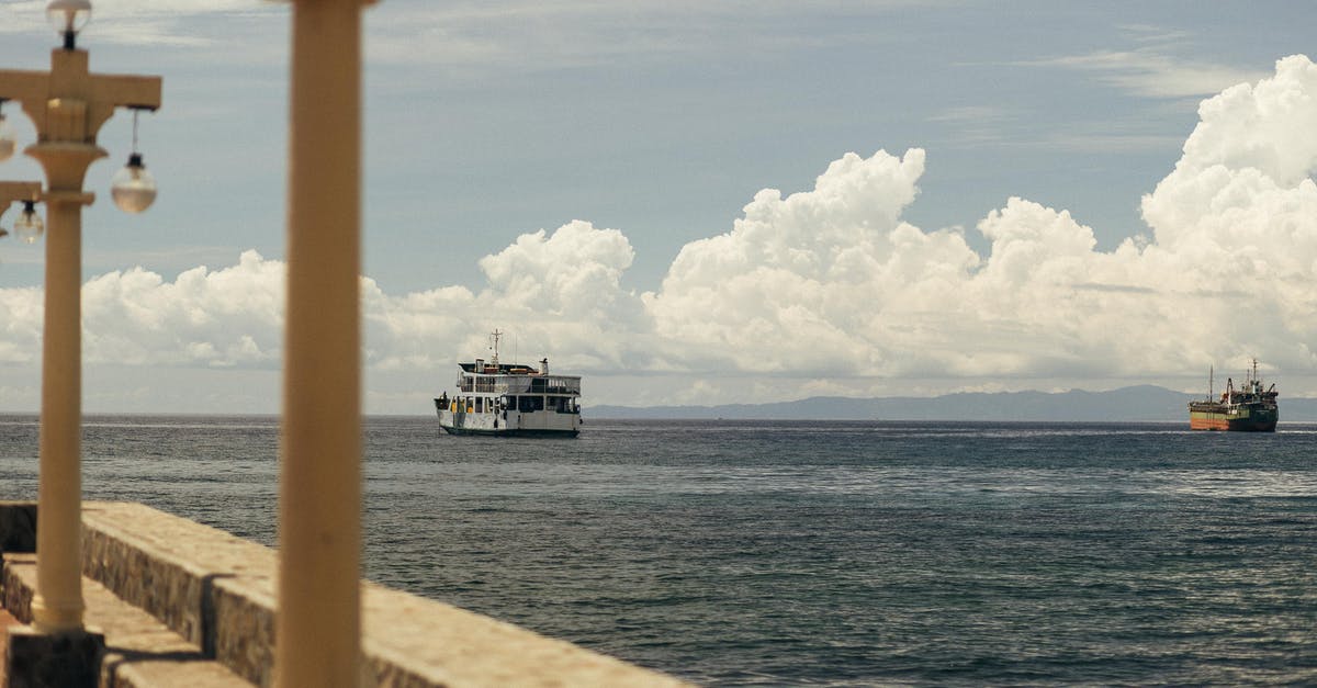 Are there any ferries between Okinawa and China? - White and Black Ship on Sea Under White Clouds and Blue Sky