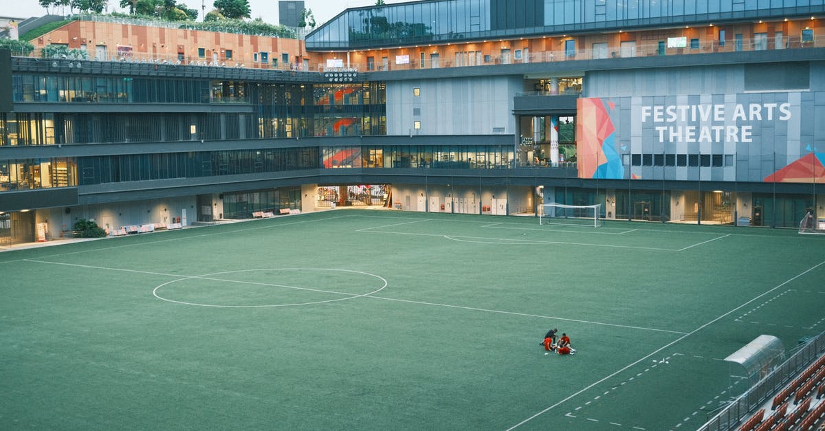 Are there any football stadiums where you can stay overnight? - People Playing Soccer on Green Field