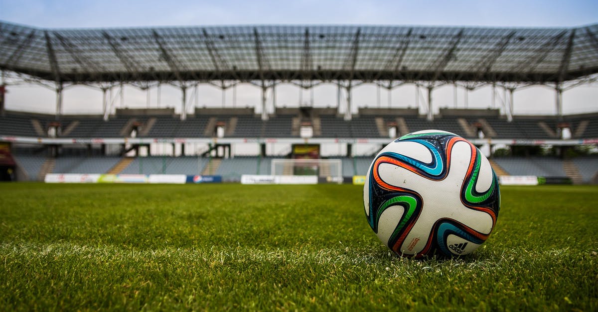 Are there any football stadiums where you can stay overnight? - Soccer Ball on Grass Field during Daytime