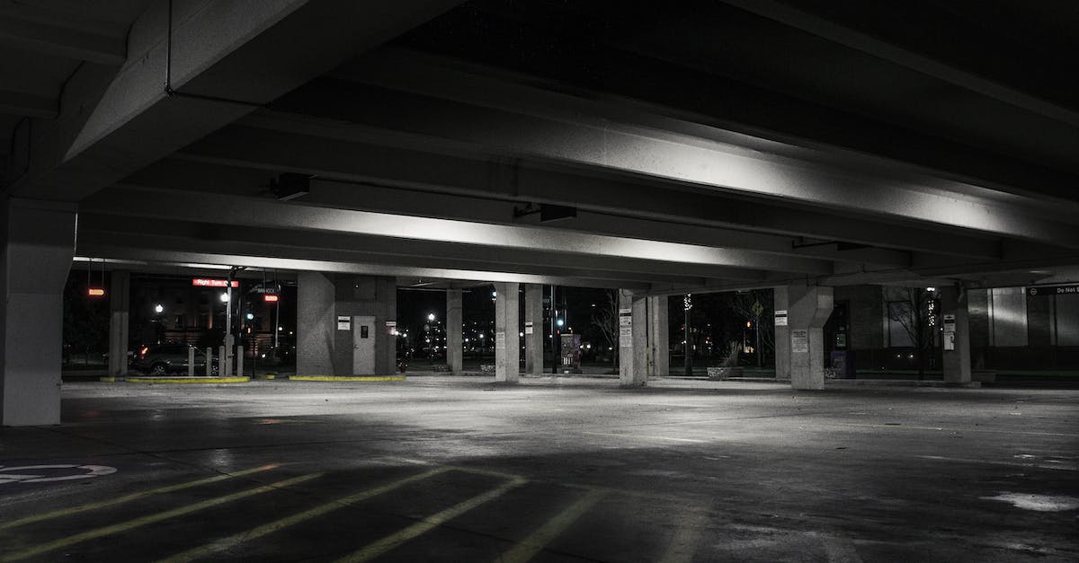Are there any guarded parking lots anywhere in or near Berlin, Germany? - Photography of Empty Parking Lot