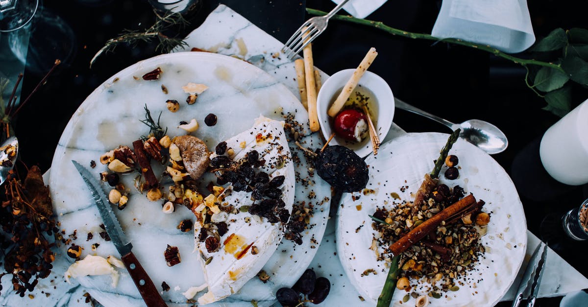 Are there any Postbuses left in the UK? - From above of plates with remains of various dishes left after festive dinner on table with cutlery and flowers