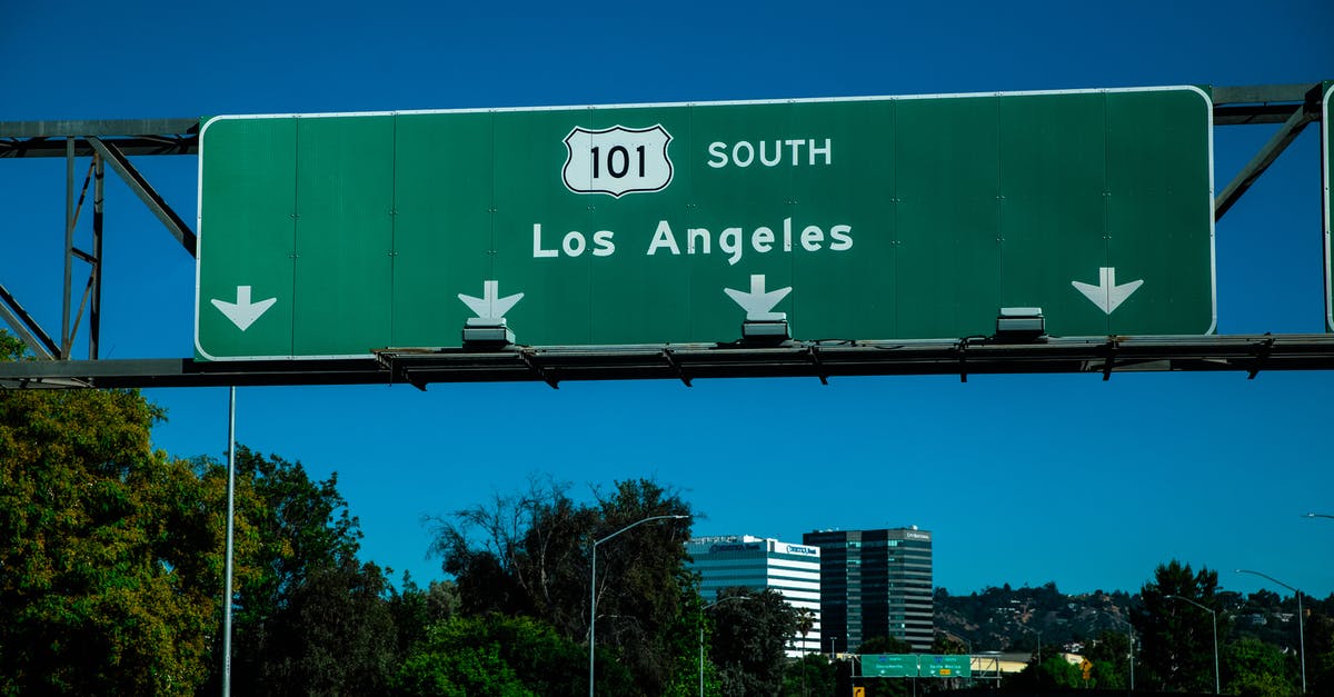 Are there any "brand" museums in Los Angeles? - Cars on Road Near Green and White Building