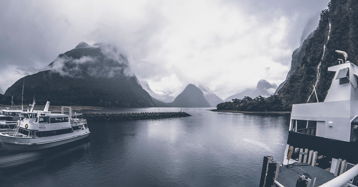 Are there any ships that go from Australia/New Zealand to Kiribati? - Grayscale Photo of Yachts on Body of Water Under Cloudy Sky