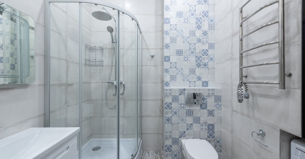 Are there any shower facilities at Heathrow Airport? - Interior of modern bathroom with shower cabin