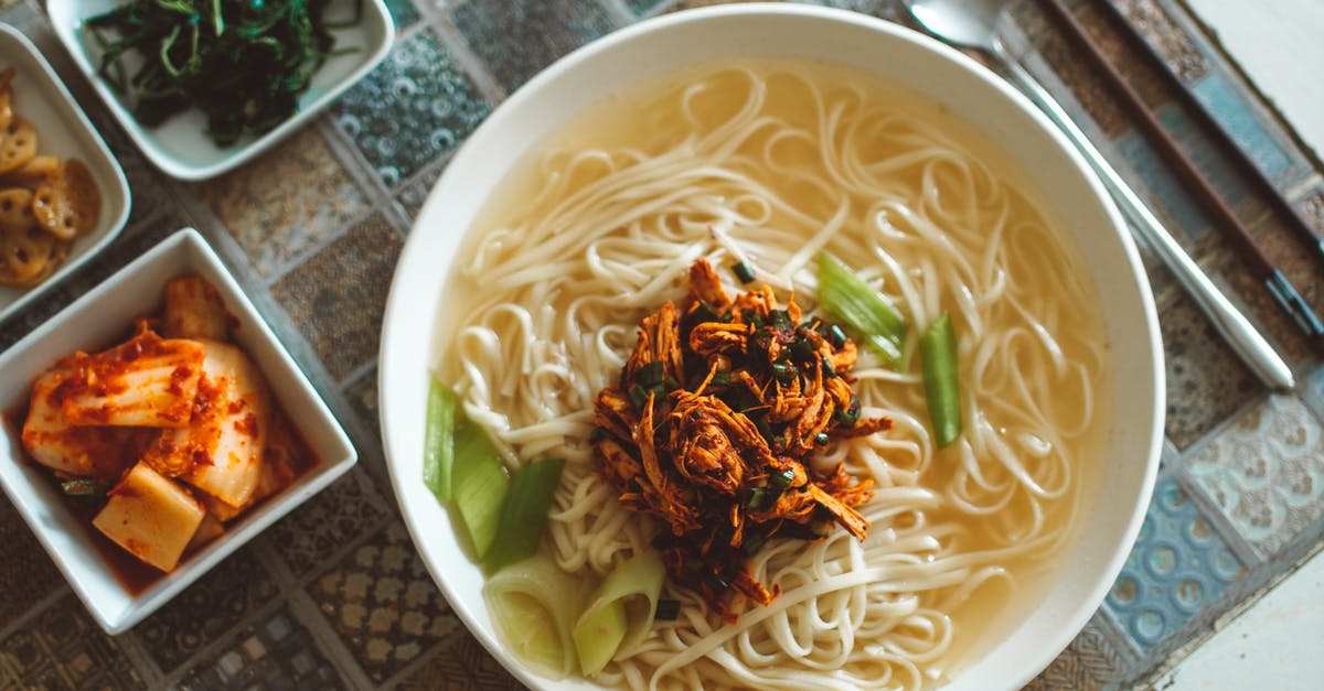 Are there any soup kitchens or food pantries in Tromsø? - Noodle Dish on White Ceramic Bowl