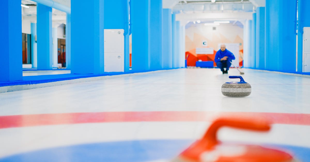 Are there any Squat houses in Paris? - Stone sliding on ice while sportsman playing curling