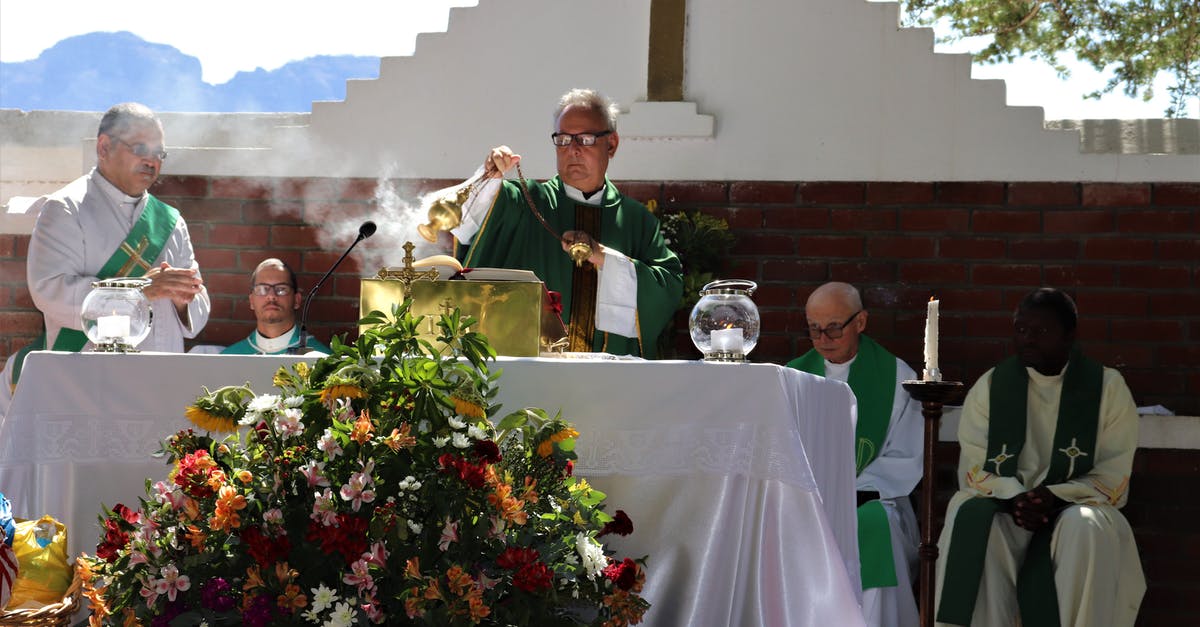 Are there any Taizé worship services in Helsinki? - Elderly priest in eyewear and catholic vestment standing with censer near table with Bible and diverse deacons during mass process near colorful bouquet in sunlight in back lit