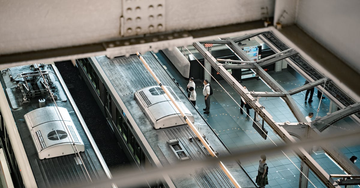 Are there any trains where roof riding is legally possible? - High Angle Shot of People Standing on Train Station Platform