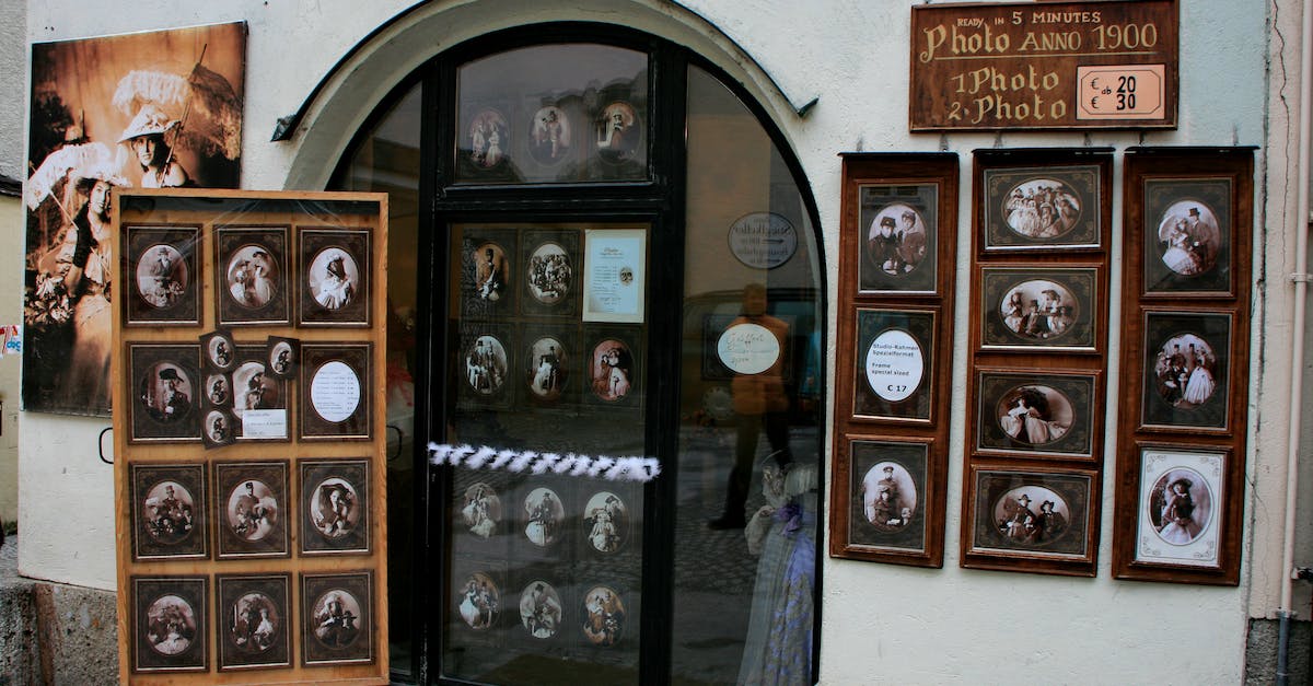 Are there any travel experiences in Australia that offer aboriginal (or Torres Strait) “cultural immersion”? - Exhibited samples of vintage photos in frames for sale on wall of small local shop