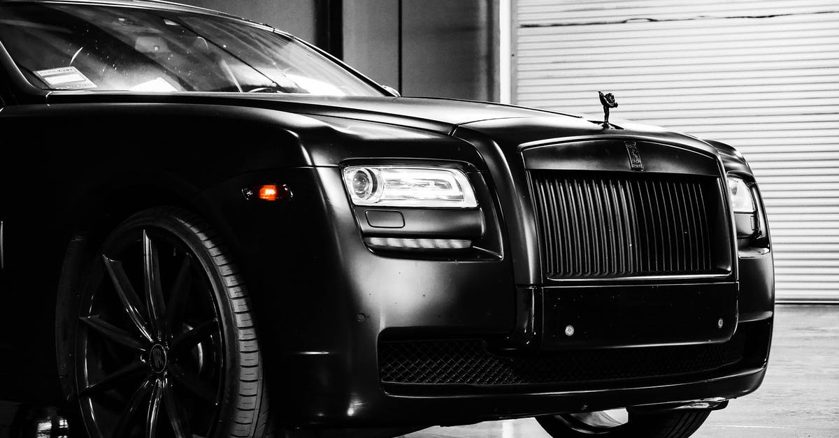 Are there any VIP Services at Nicaragua airport? - Hood of elegant luxury black car parked on marble floor in modern building garage