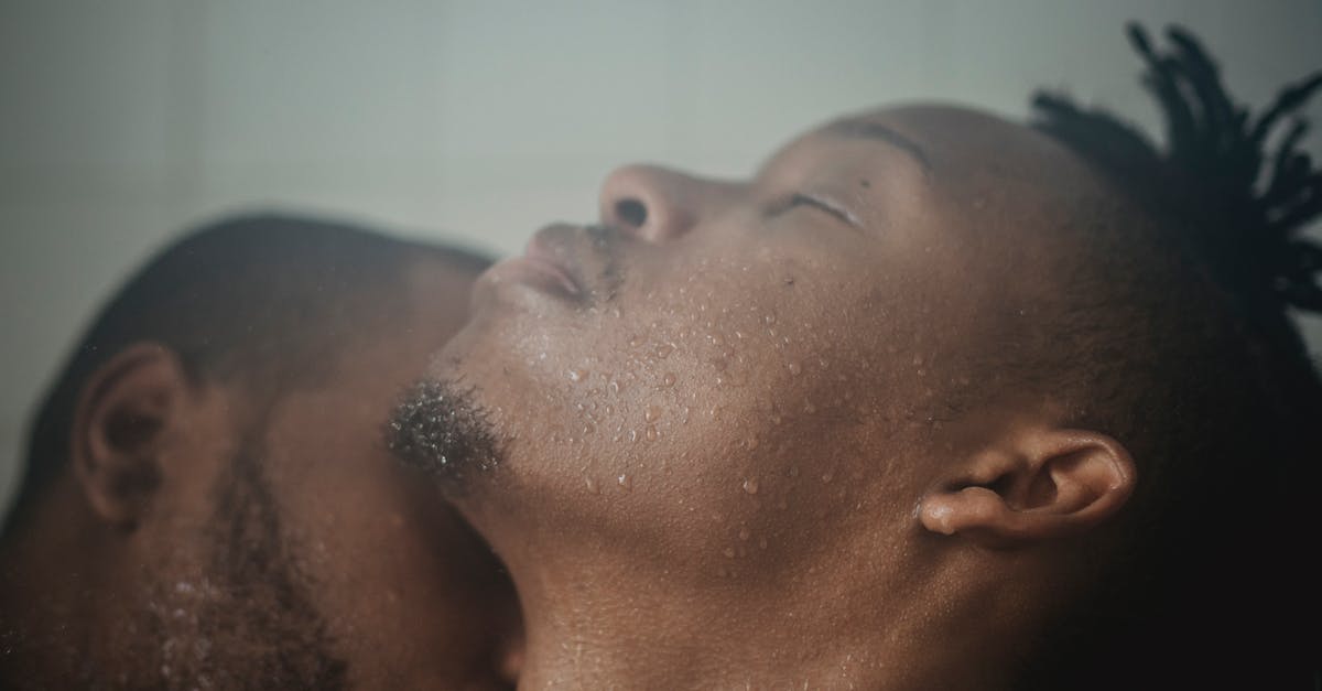 Are there caveats not having a permanent address? - Close-up of Couple Having Shower Kissing