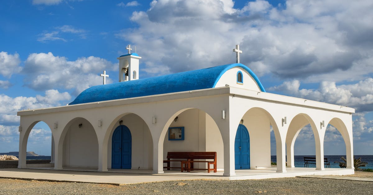 Are there cross-border buses between Cyprus and North Cyprus? - White and Blue Painted Church Under Blue Sky