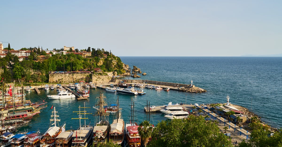 Are there ferries from west coast of Turkey to Greece? - Pile of Assorted-color Boats