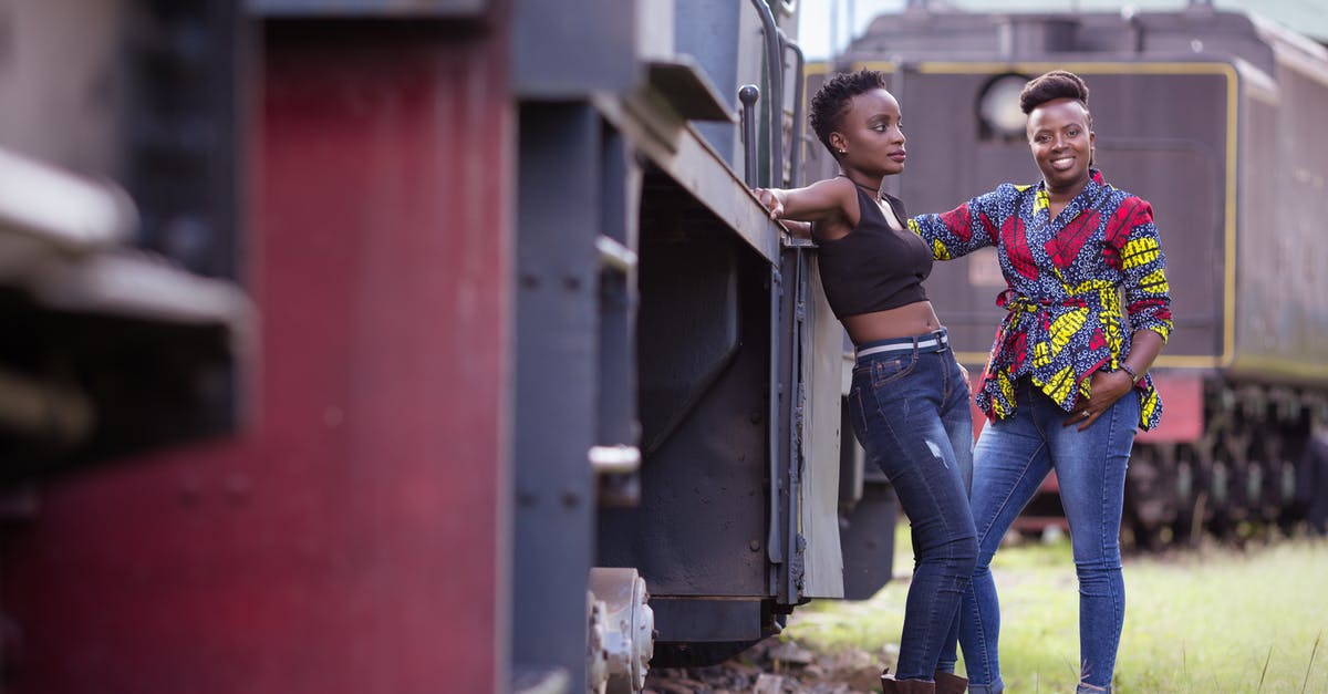 Are there restrooms on trains in Israel? - Women Posing among Trains