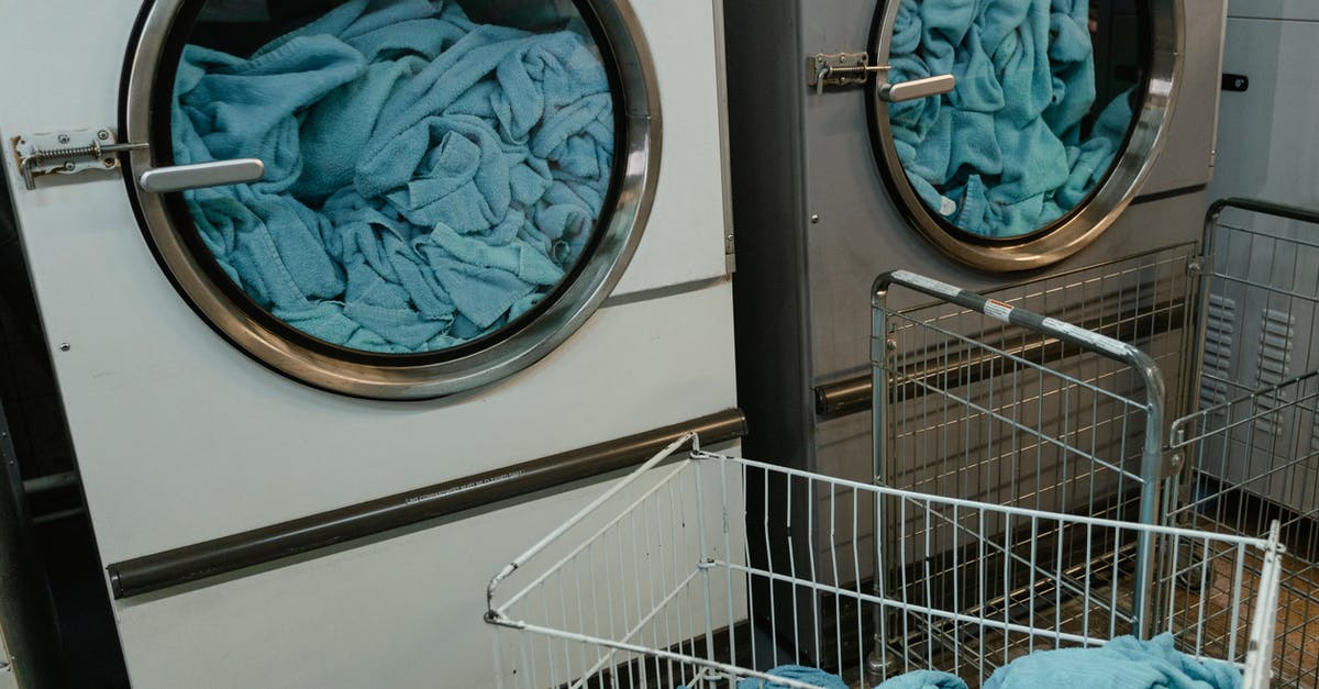 Are there self-service laundries in Arendal? - White and Gray Washing Machine with Blue Fabrics inside