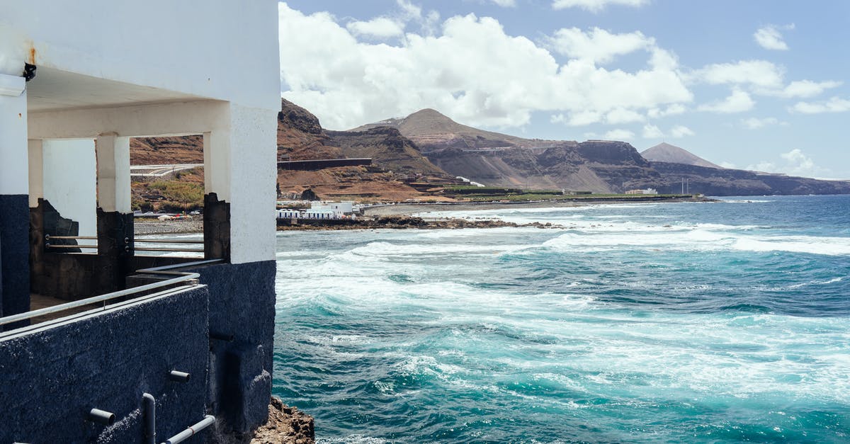 are there shuttles to Canary Island ferry ports - Building Near the Cliff