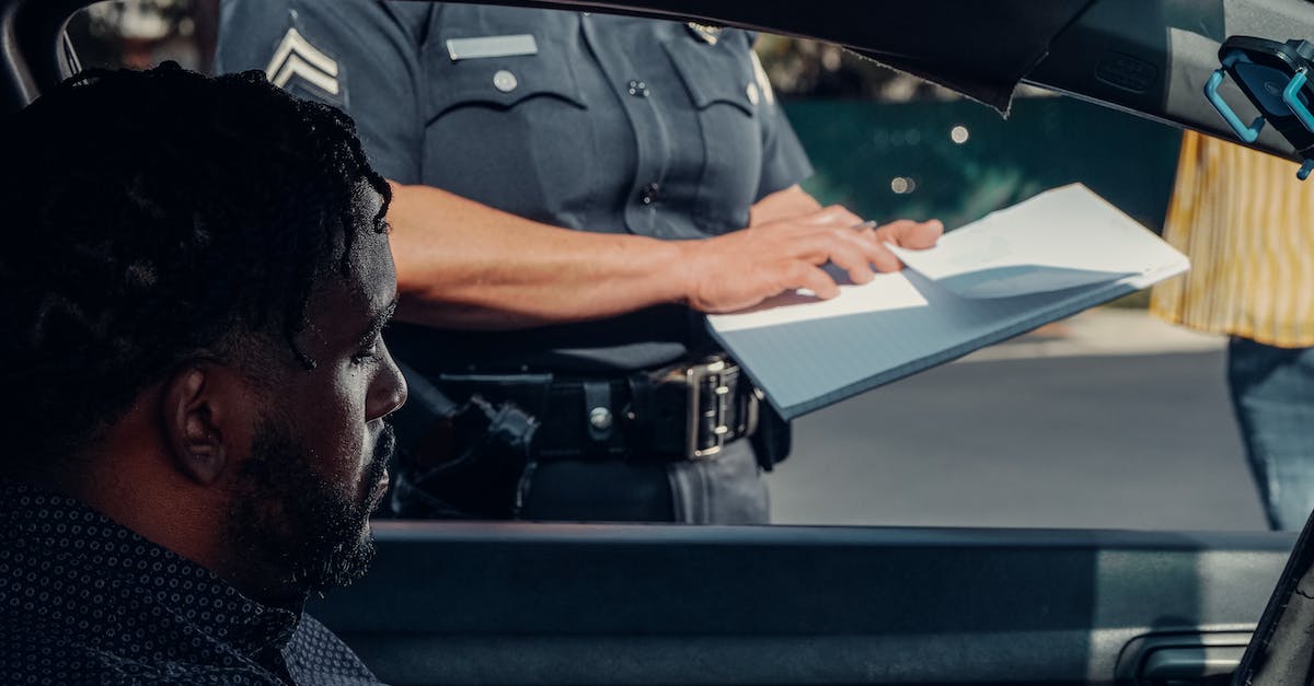 Are there ticket offices for Georgian Railways in Tbilisi? - Police Officer Standing Next to the Car Window 