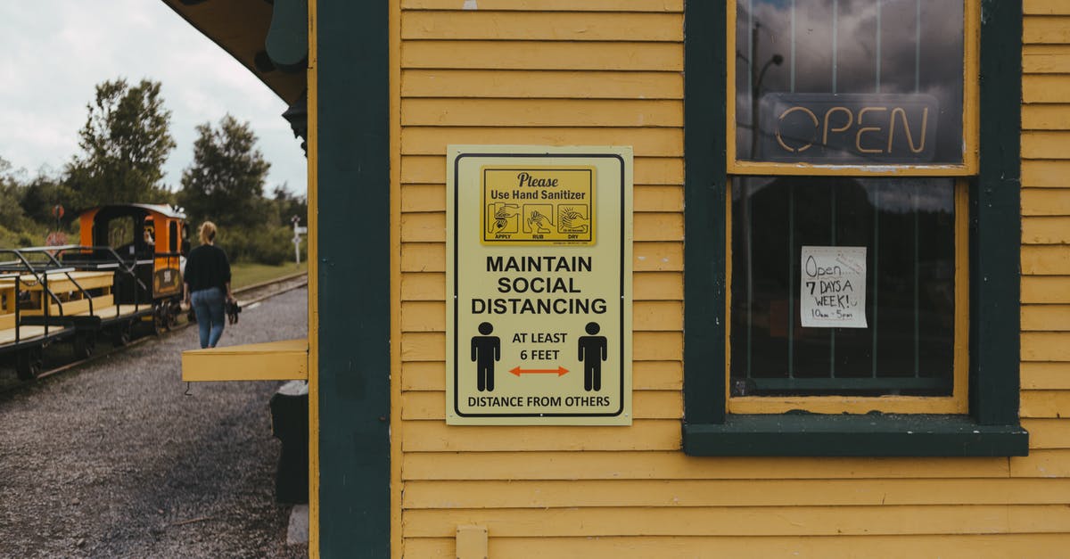 Are there toilets on the long-distance Translink trains in Queensland? - Information Sign Beside a Window