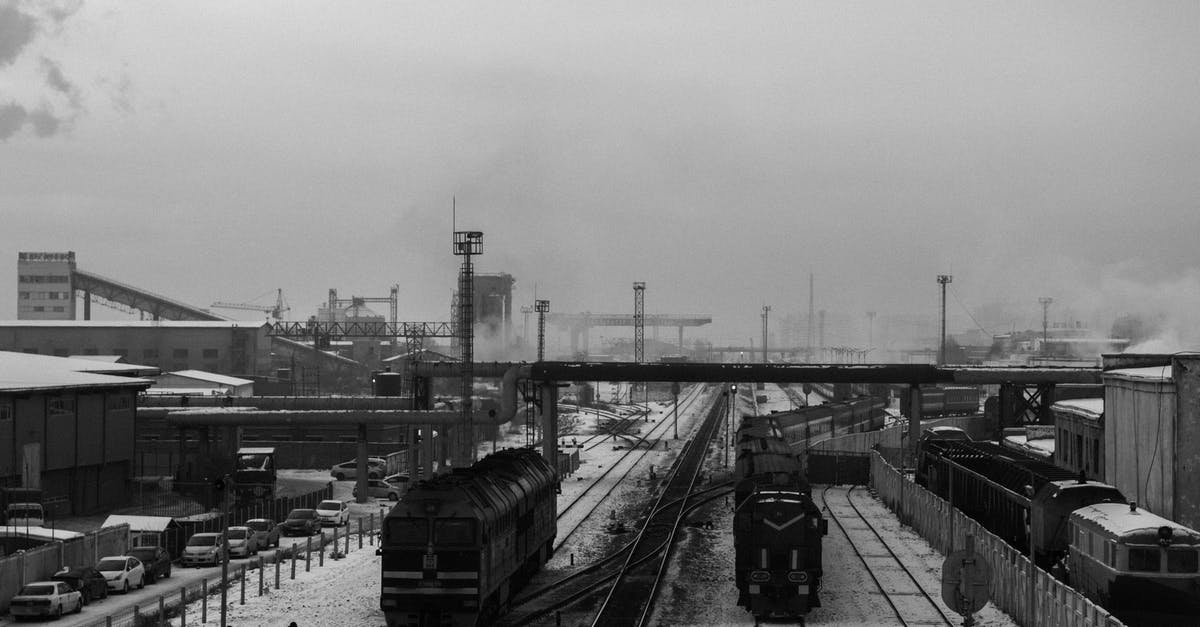 Are there trains without WC in the Netherlands? - Grayscale Photo of Train on Rail Tracks