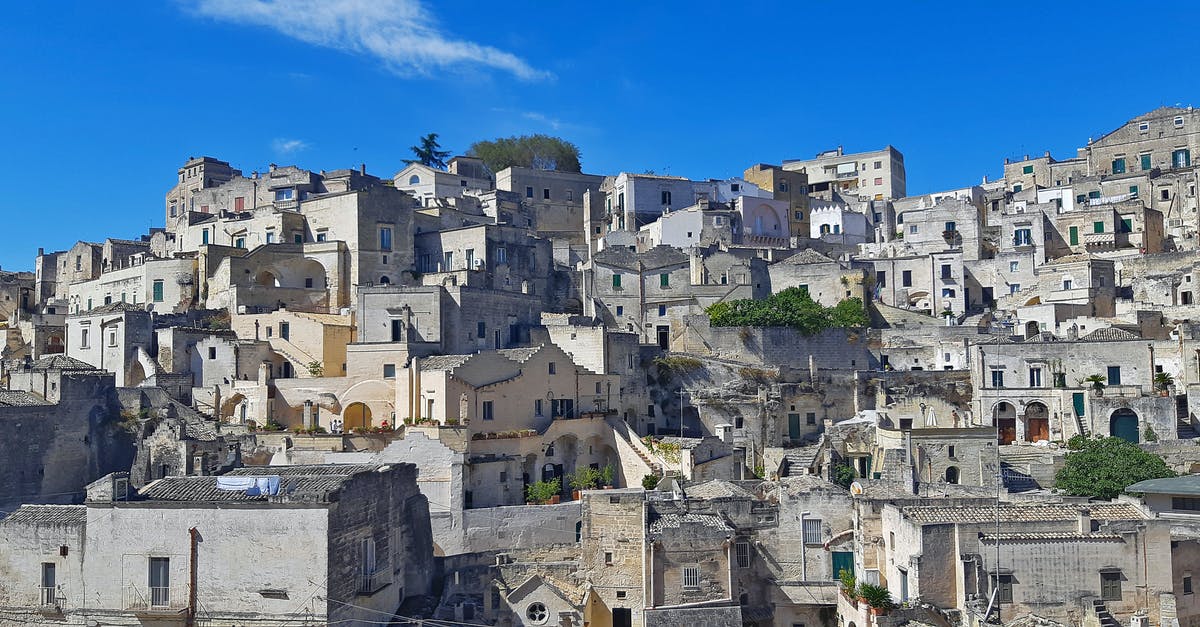 Are traveler's cheque widely accepted in Iran? - Ancient Houses on Hill against Blue Sky