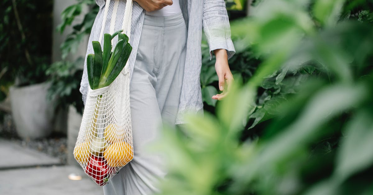 Are truffles (the edible fungi) allowed in carry on? - Crop unrecognizable woman carrying bag with organic vegetables in garden