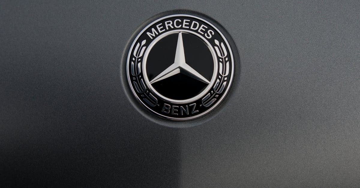 Are unofficial International Driving Permits of any use? - Logo of famous automobile concern on dark gray background