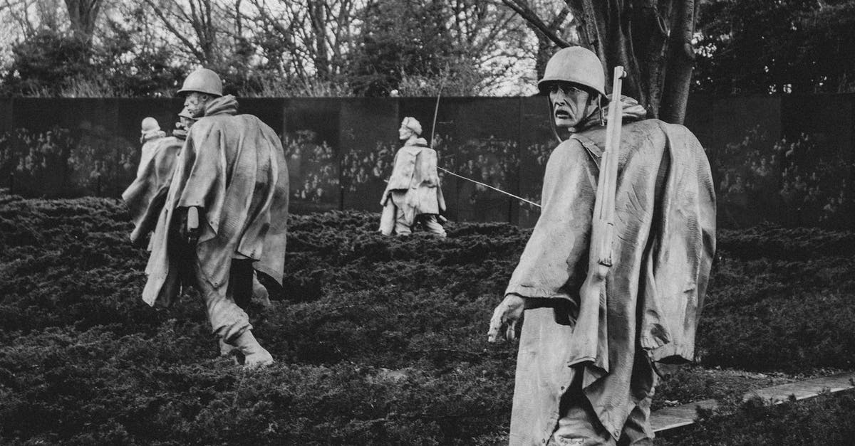 Are visitors to Iran etc still ineligible for the US Visa Waiver Program? - Grayscale Photo of Statues