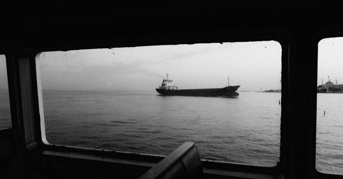 Are you able to visit the ship breaking yards in Bangladesh? - Grayscale Photo of Ship on Sea