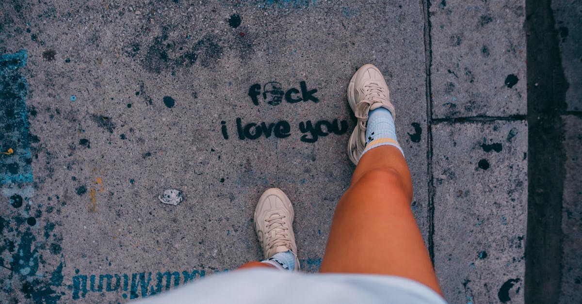 Are you considered a stateless person if you lose your passport? - Person in White Shorts and White Sneakers Standing on Gray Concrete Pavement