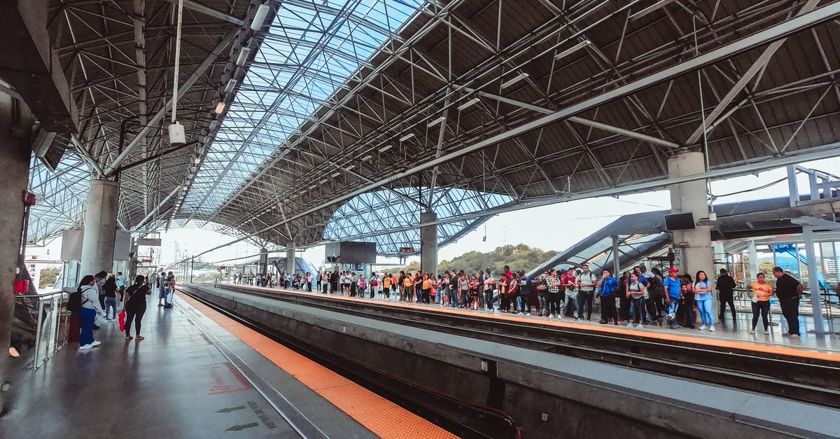 Arrival and departure on same day to/from India - Crowd of people standing on platform of railway station and waiting train in busy day