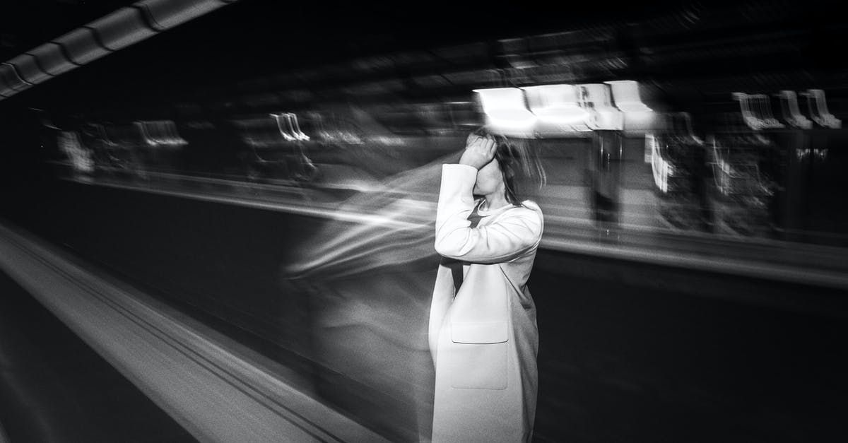 Arrival time of French Bee [duplicate] - Faceless woman waiting for metro cabin in subway