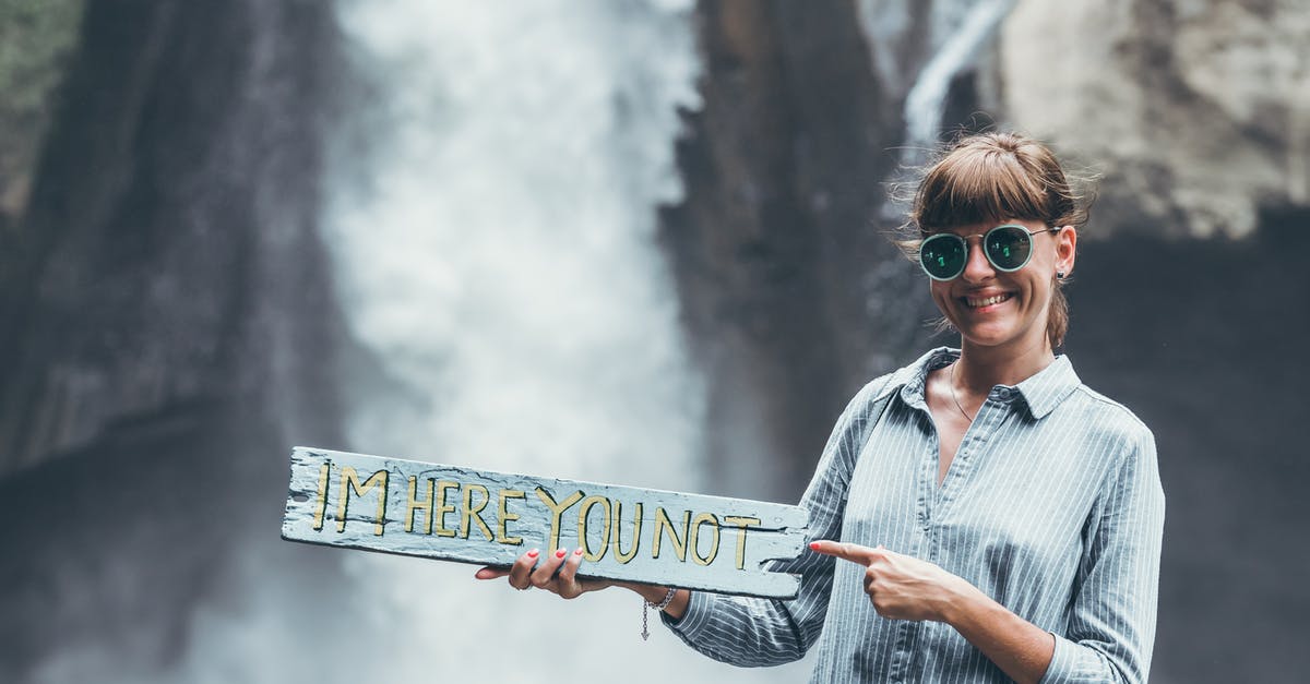 Attending 3 day conference but a tourist for 10 days - Woman Carrying Im Here You Not Plank on Front of Waterfalls