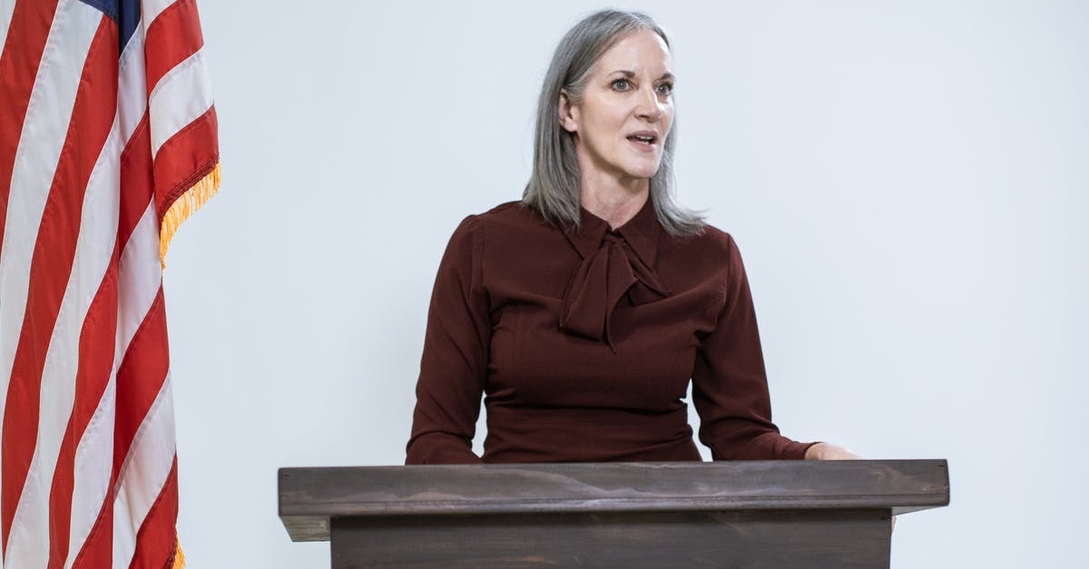 Attending a conference in the US - Woman in Red Long Sleeve Shirt