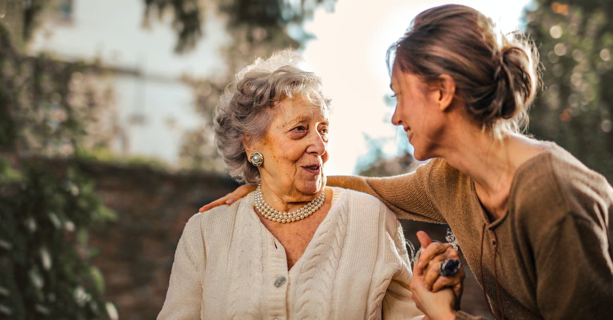 Attestation d'accueil for connections in other country? - Joyful adult daughter greeting happy surprised senior mother in garden