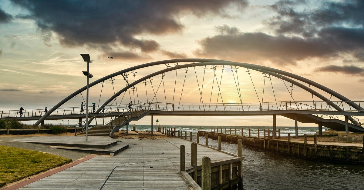 Australia ETA (Evisitor) - Gray Metal Bridge over Body of Water Under Gray Clouds