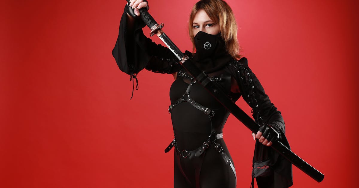 Australian to Japanese power converter? - Woman wearing costume with katana in studio