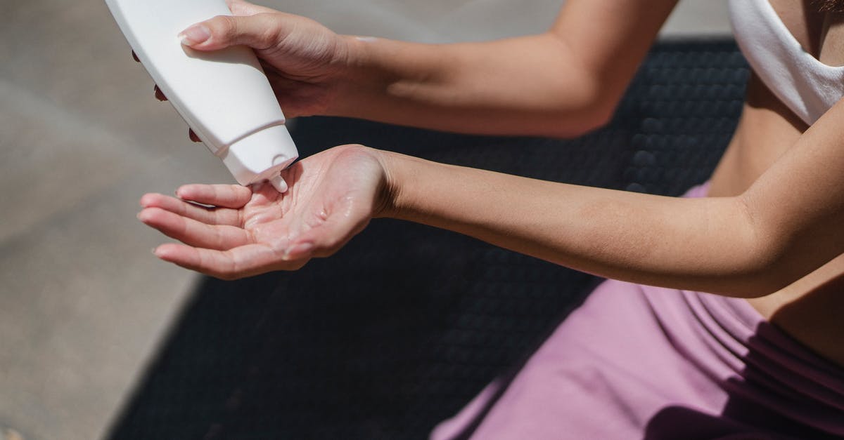 Australian Tourist visa - apply from India and travel from USA - Faceless woman applying lotion on hand on sunny day