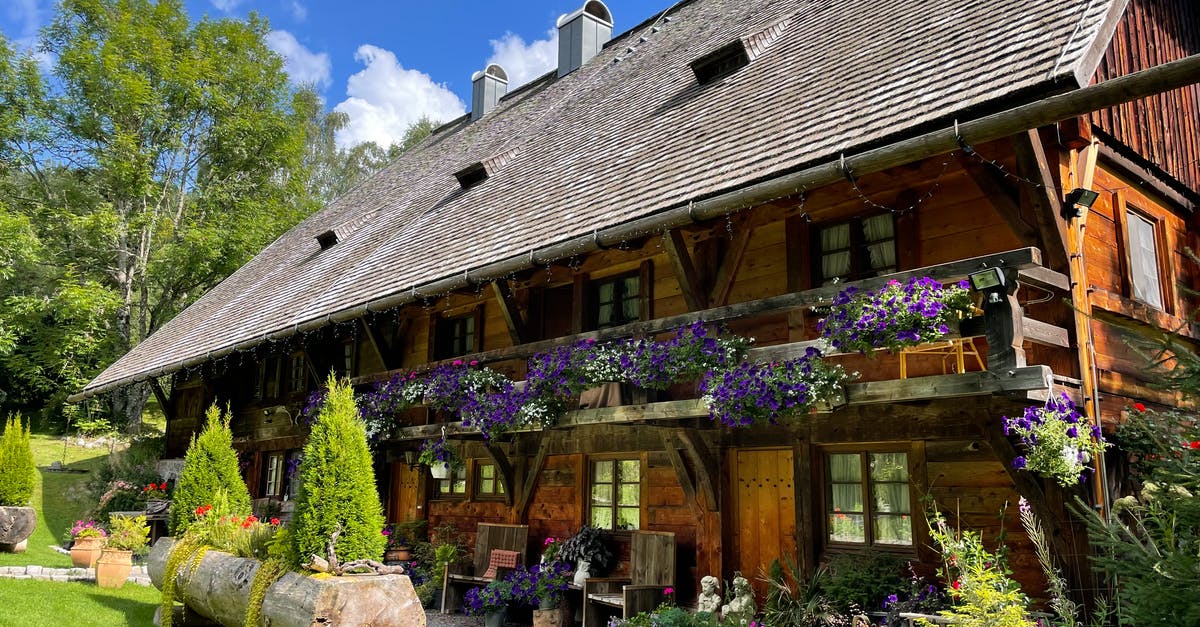 Australian with German Residence Permit... Schengen? - A Wooden House with Plants Under the Blue Sky