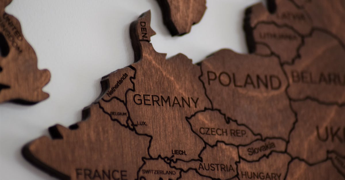 Austria - Czech Republic - Germany - What is the best option for mobile phone - Close-Up Photo of Wooden Jigsaw Map