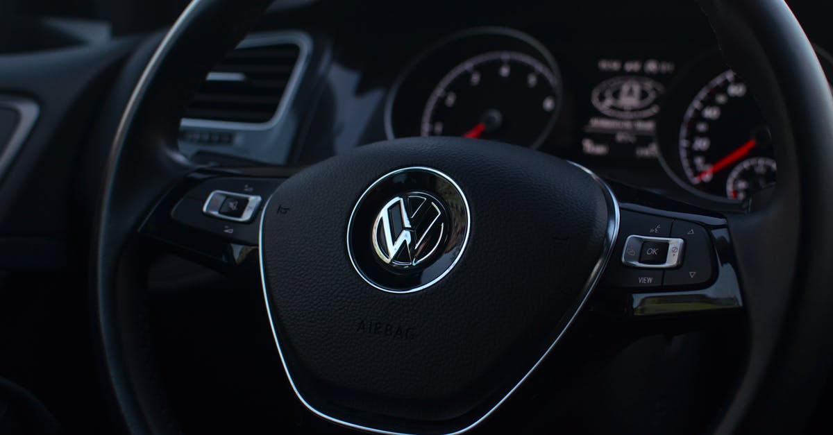 Automated passport control in the EU - Interior of modern automobile with buttons on steering wheel with panel containing instruments and controls