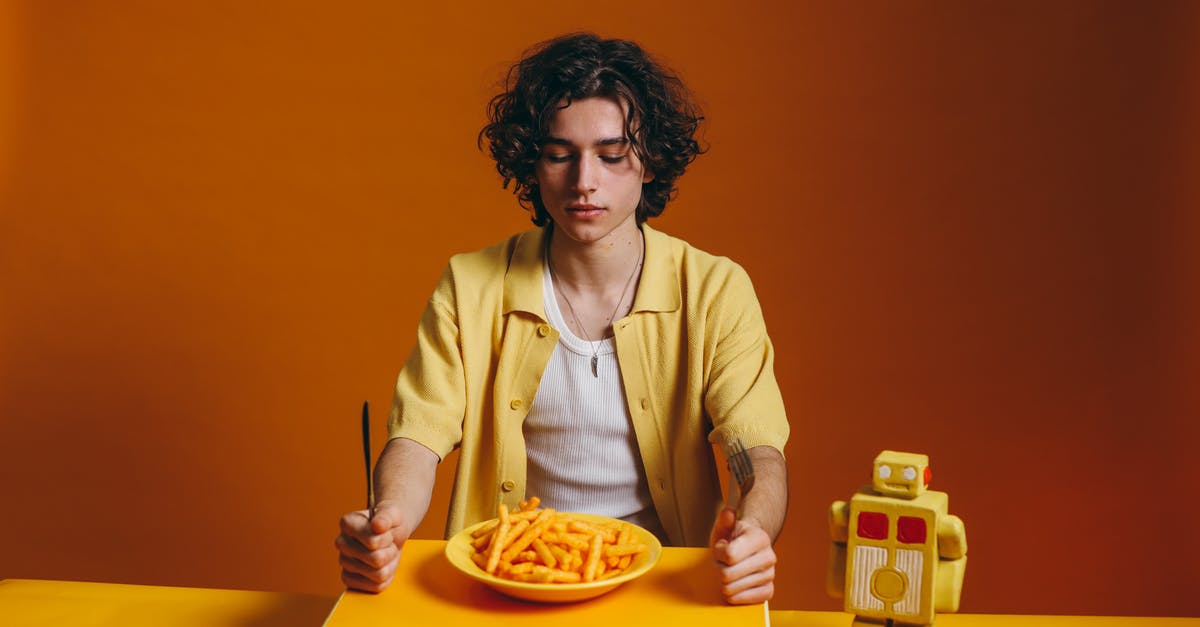 Availability of DSB Orange Fri tickets in August - Young Man Looking Down On A Plate Of Fries