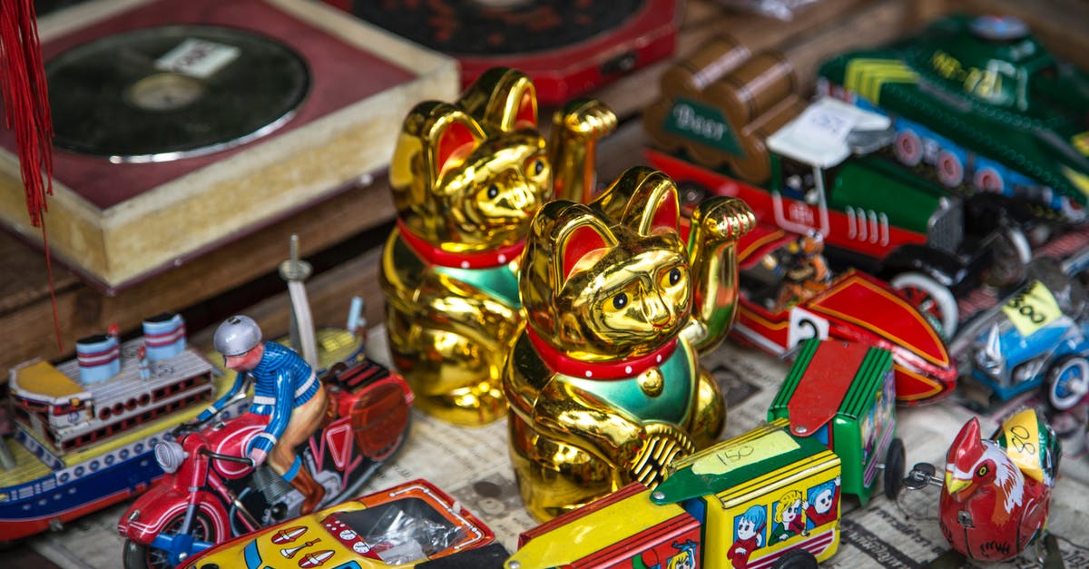 Availability of local train tickets in France - Collection of vintage toys on shelf