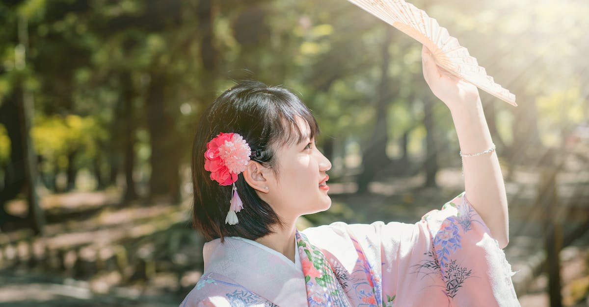 Avoiding human trafficking when getting a massage in Japan - Woman in White and Pink Floral Kimono