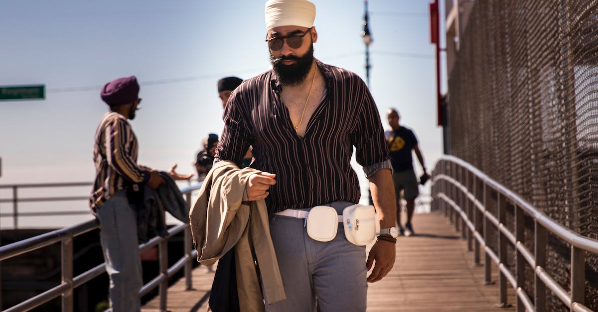 Avoiding the traveller's 'fanny pack' / money-belt - Man Standing on Walkway