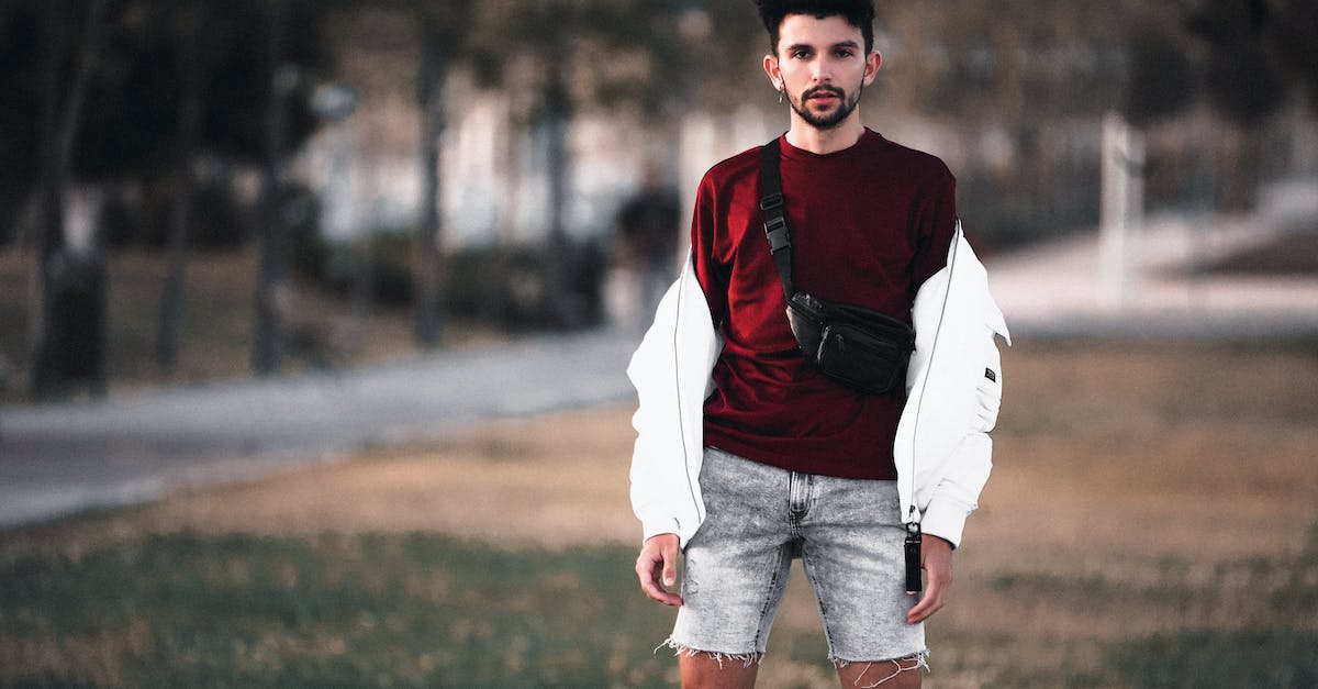 Avoiding the traveller's 'fanny pack' / money-belt - Shallow Focus Photo of Man in Red Shirt and Shorts