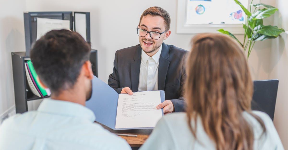 B-1/B-2 Visa Working with US clients - A Broker Showing a Couple the Mortgage Contract