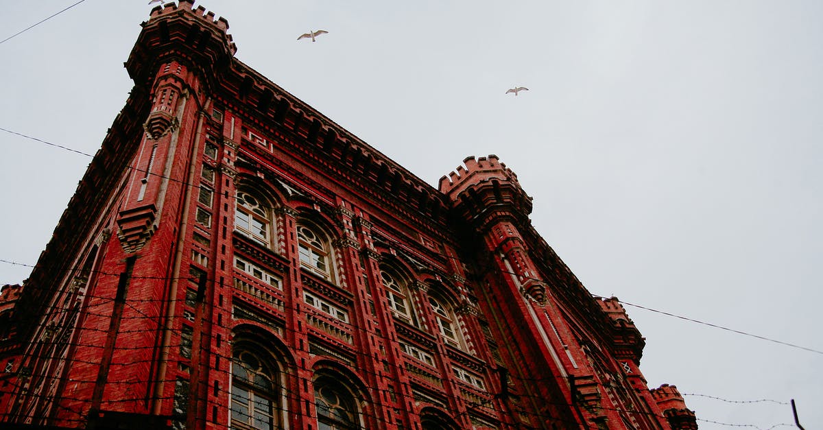 B2 visa for grad school visiting and sightseeing in USA? - From below of aged masonry lyceum exterior with arched windows and ornamental walls under soaring birds in Istanbul