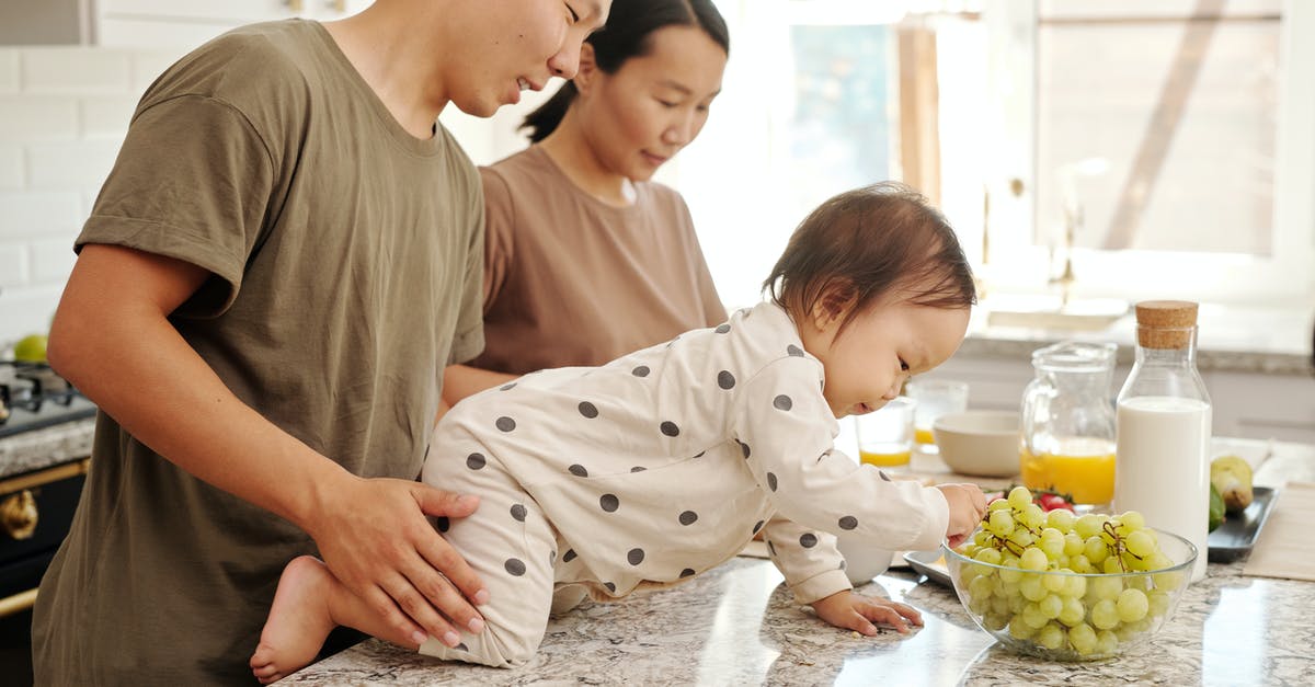 Baby food in checked bags? - A Toddler Picking Fresh Grape in a Bowl